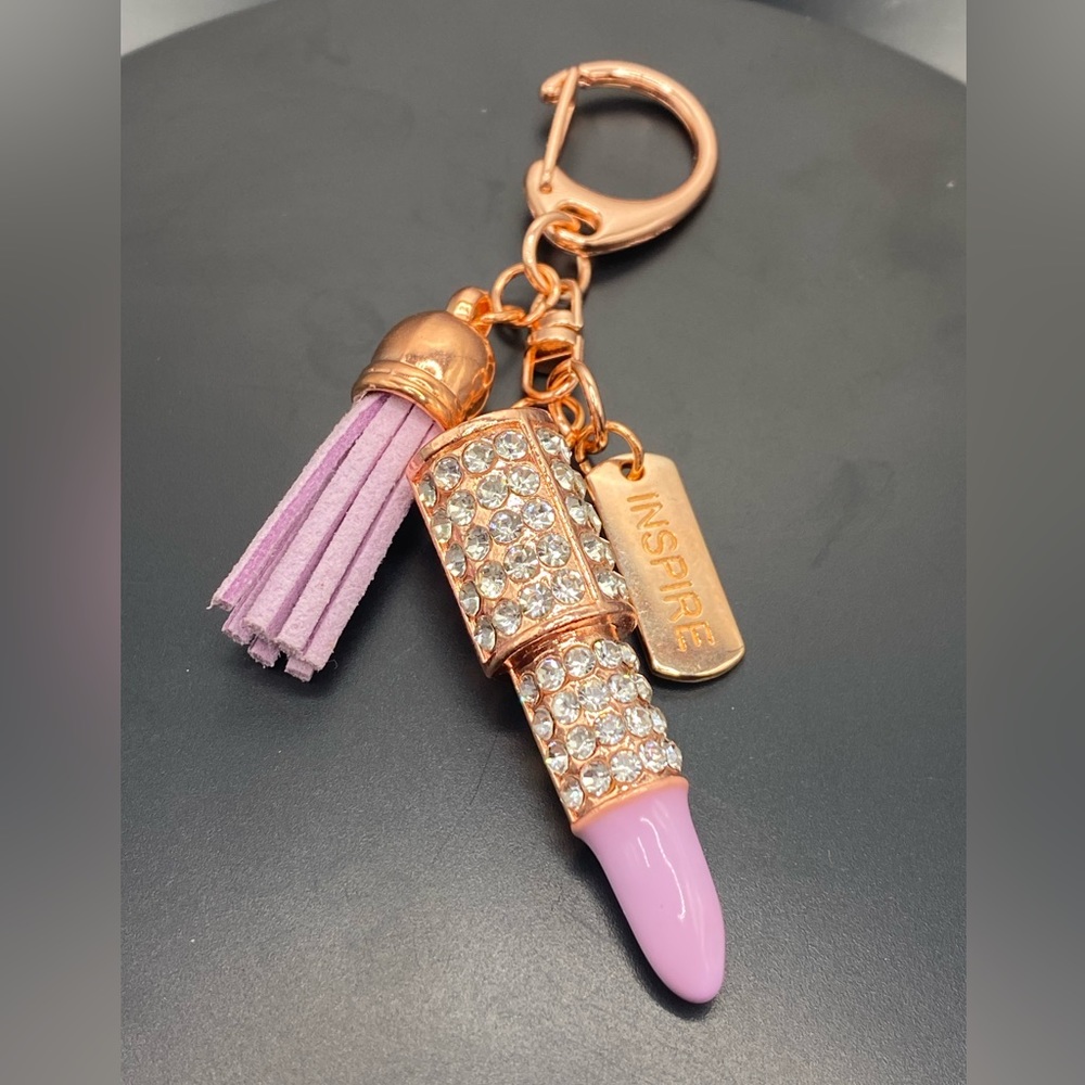 Lavender crystal lipstick rose gold keychain with tag that says inspire